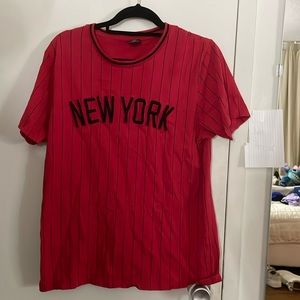 Red shirt that’s says New York